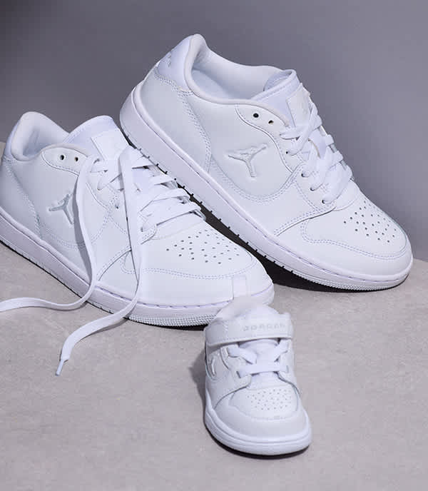Three different size of white Jordan sneakers