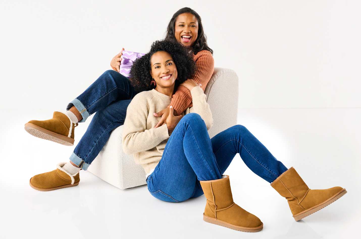 Two women bestfriends are wearing comfortable cozy boots