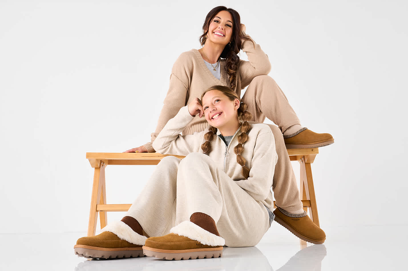 A stylish mother-daughter duo wearing comfy clogs from Koolaburra by UGG
