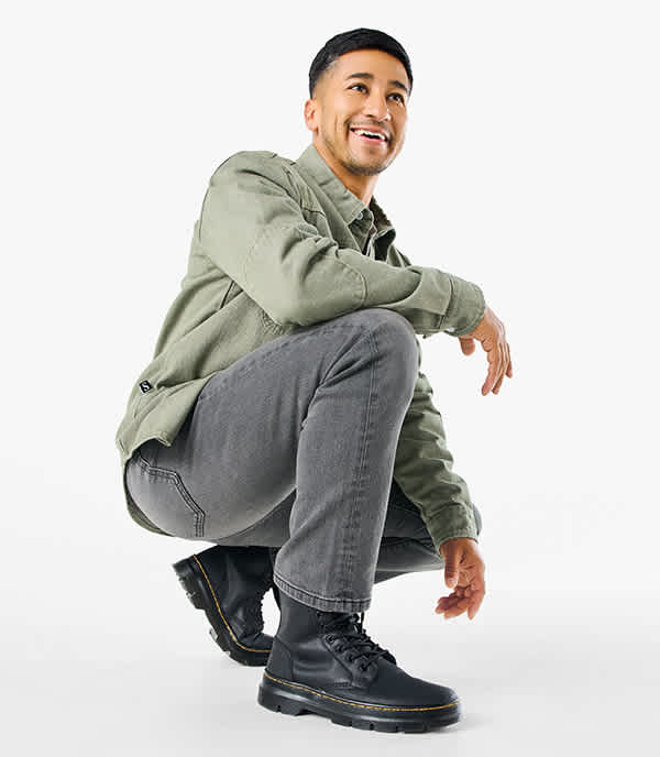 A man wearing black boots