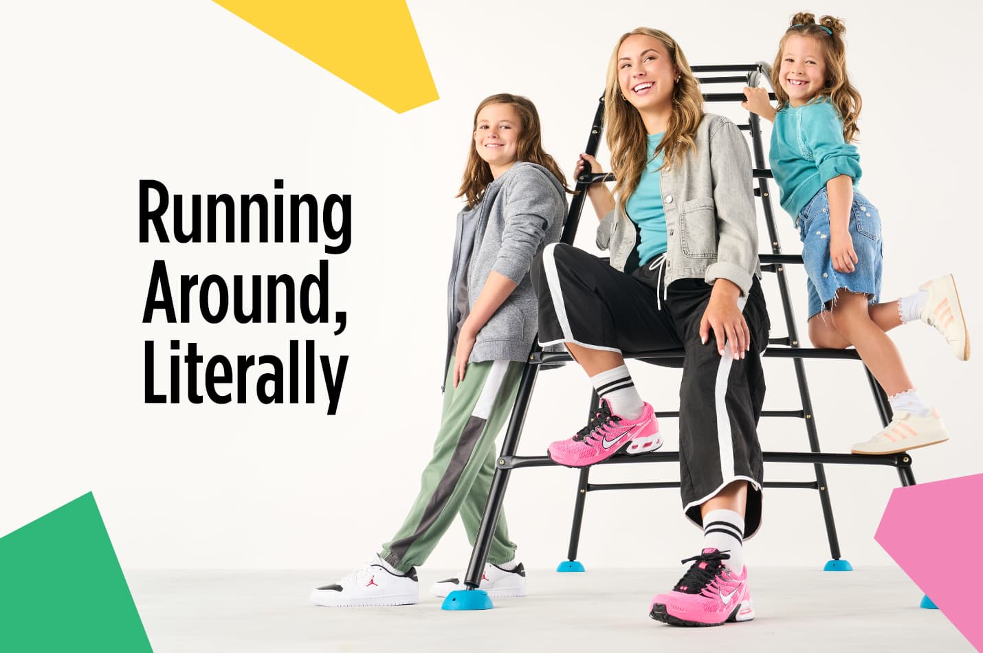 Four athletic sneakers are vertically aligned on white background