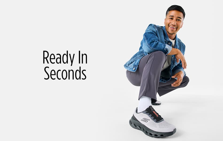 Man crouched down with right foot out front in Skechers sneaker.
