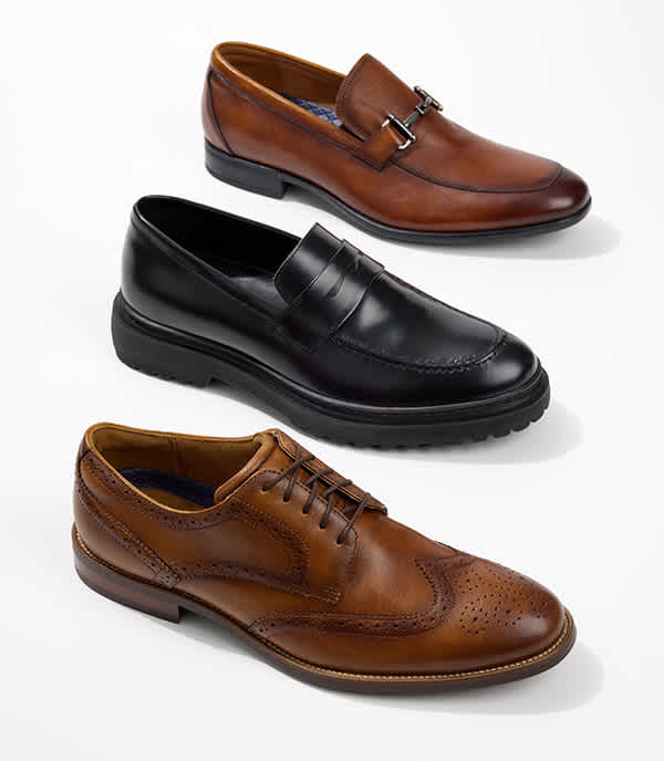 Men's dress shoes, slightly tilted and pointed in the same direction