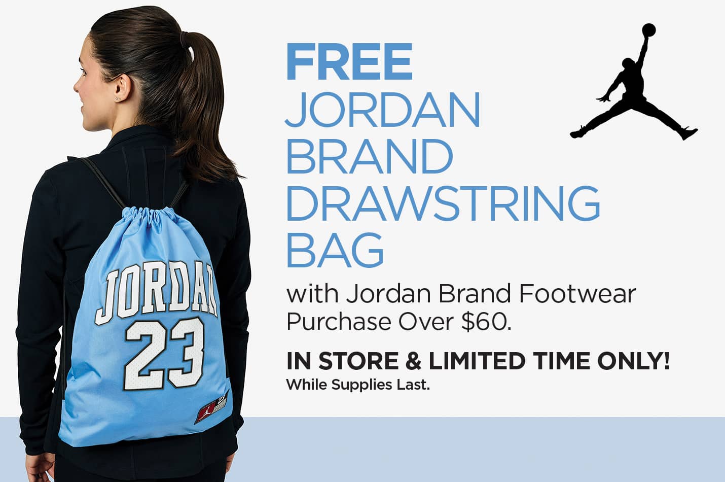 The back of a girl wearing a blue and white Jordan Brand 23 drawstring bag, get one free with the purchase of Jordan Brand footwear over $60.