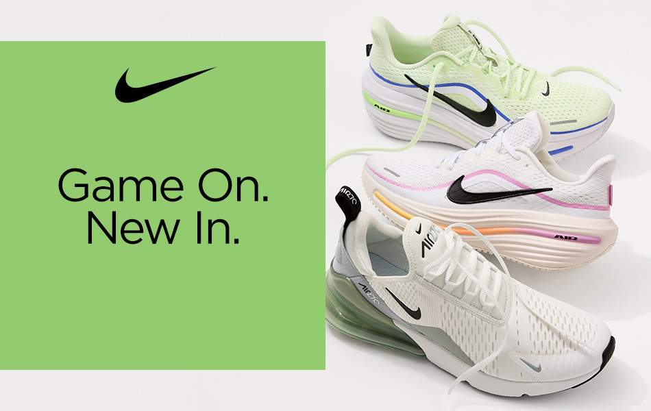 Three different pairs of light colored Nike athletic shoes in a vertical line, perfect for Summer day trips.