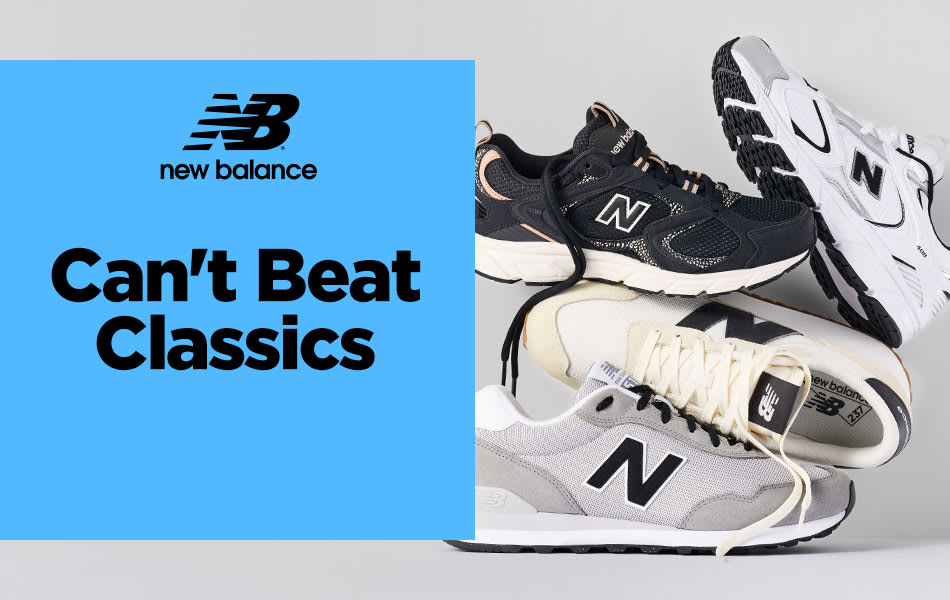 Four different New Balance sneakers and running shoes precariously stacked on top of each other on a white background.