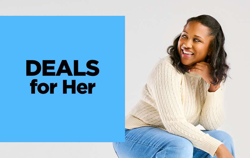 A young woman sitting on a white plint smiling and looking to the side.